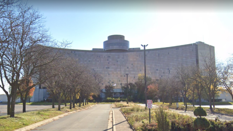 A large, curved 18-story building