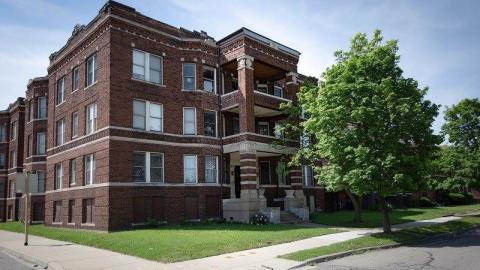 A three-story brick apartment building
