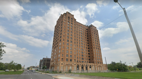 A tall abandoned brick building in Detroit