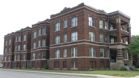 A four-story brick apartment building