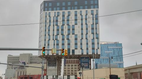 A 16-story under construction black and white building 
