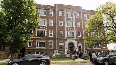 A four-story historic brick apartment building
