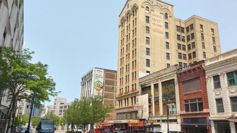 A city block with a tall building in the middle