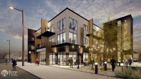 A rendering of a three story apartment building with retail on the bottom