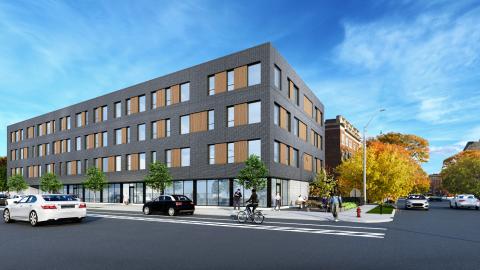 A rendering of a four-story apartment building