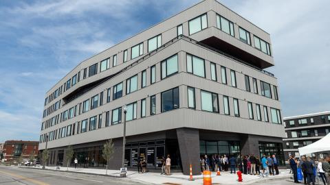 A new four story apartment building with an offset top floor