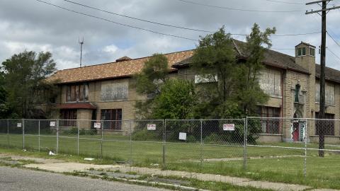 A large abandoned two story brick school